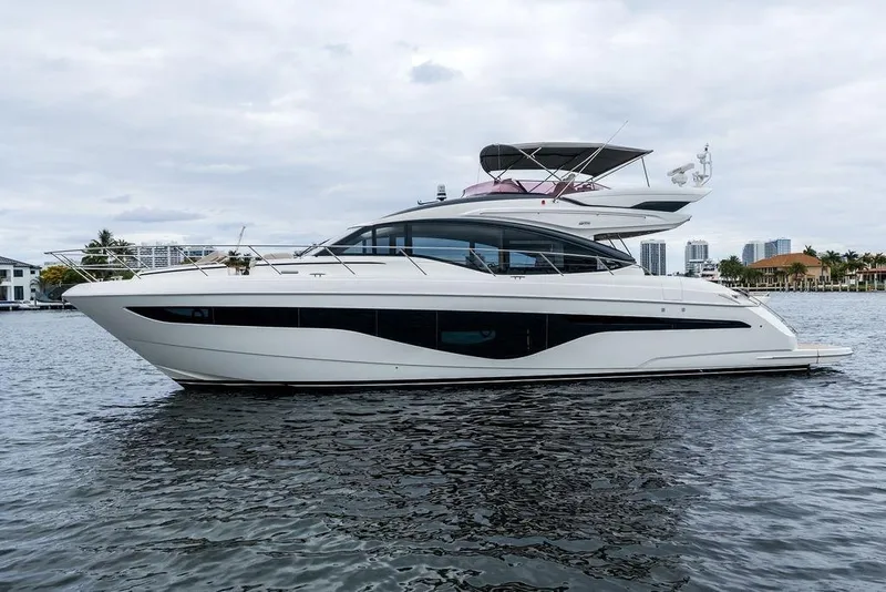 Slide: The Image of Luxurious 2020 Princess S62 yacht on calm waters, showcasing sleek design and modern elegance. - 2