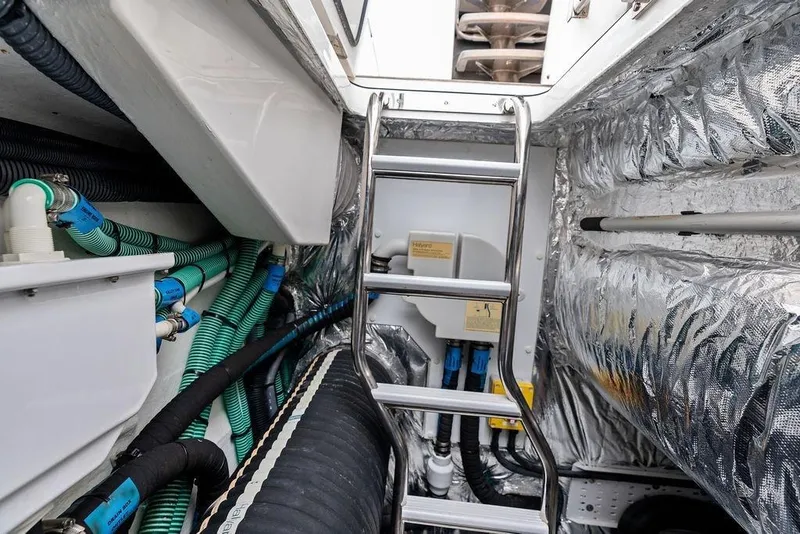 Slide: The Image of Engine room of 2020 Princess S62 yacht with ladder and insulated walls. - 80