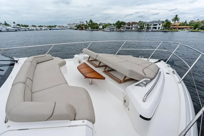 Slide: The Image of Luxurious 2020 Princess S62 yacht deck with comfortable seating and scenic waterfront view. - 13