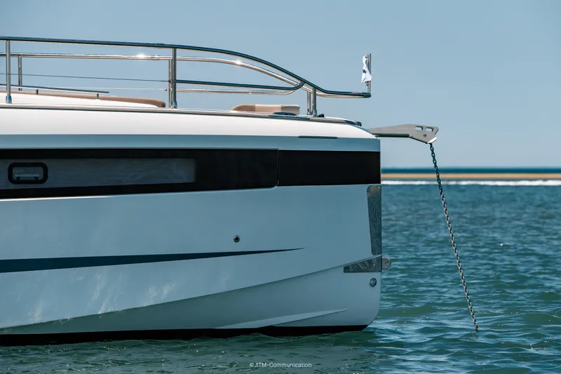 Slide: The Image of 2026 Wellcraft 44 Explorer yacht anchored in serene blue waters. - 21