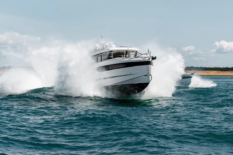 Slide: The Image of 2026 Wellcraft 44 Explorer cruising through ocean waves, showcasing speed and power. - 4