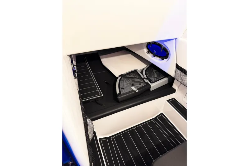Slide: The Image of Interior cabin of 2026 Nor-Tech 390 Sport boat with sleek black and white design. - 11