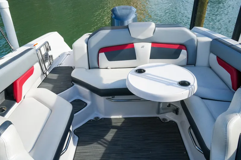 Slide: The Image of 2018 Four Winns HD240 OB boat interior with stylish seating and round table. - 36