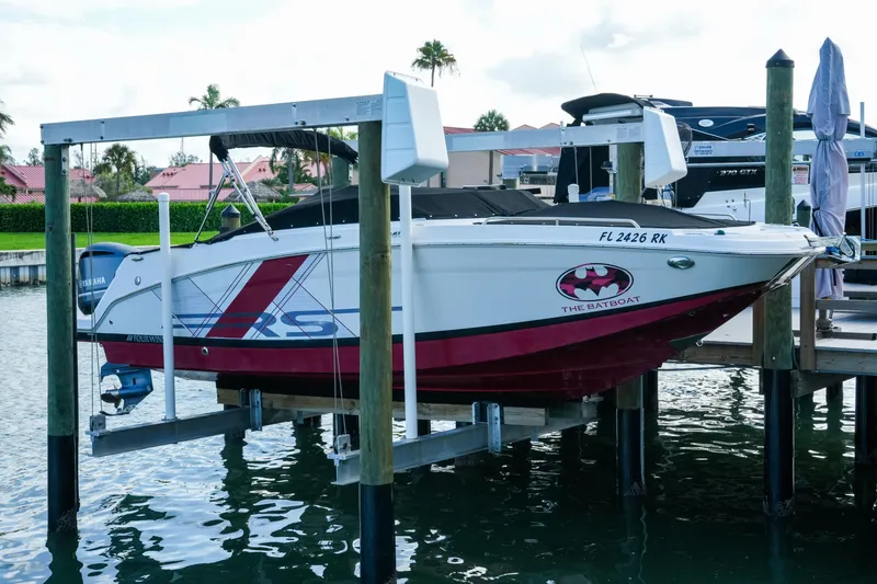 The Image of 2018 Four Winns HD240 OB boat docked, featuring custom "The Batboat" design. - 0