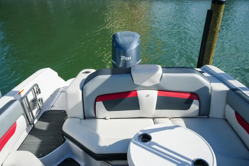 Slide: The Image of 2018 Four Winns HD240 OB boat interior with seating and outboard motor. - 37