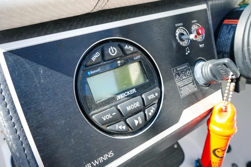 Slide: The Image of Control panel of 2018 Four Winns HD240 OB boat with Kicker stereo system. - 40