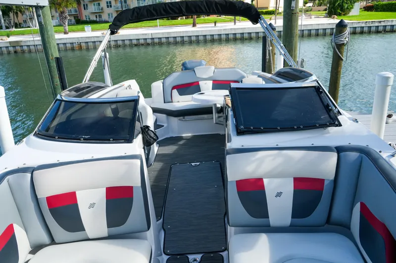 Slide: The Image of 2018 Four Winns HD240 OB boat interior with stylish seating and waterfront view. - 31