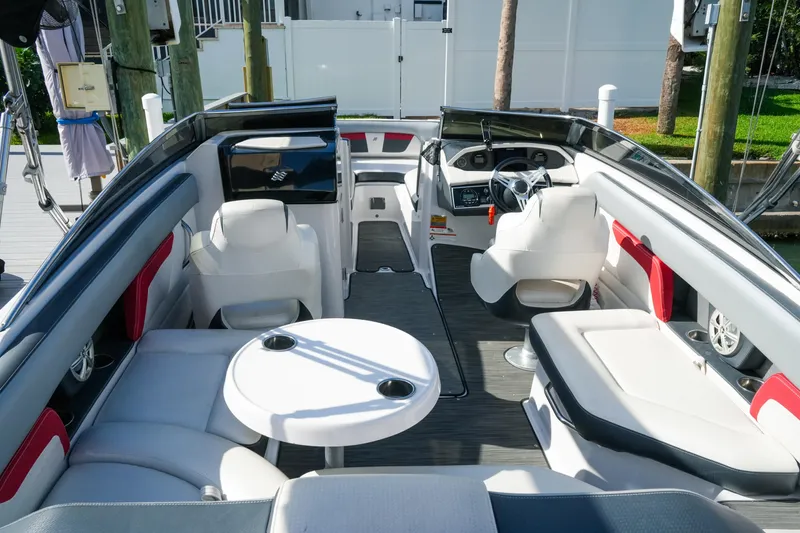 Slide: The Image of 2018 Four Winns HD240 OB boat interior with white seating and sleek design. - 48