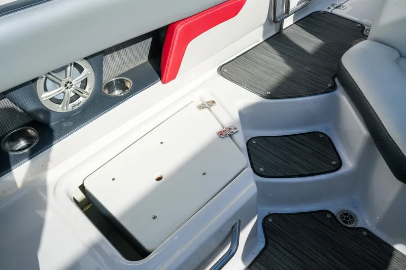 Slide: The Image of Interior of 2018 Four Winns HD240 OB boat, featuring seating and speaker system. - 45