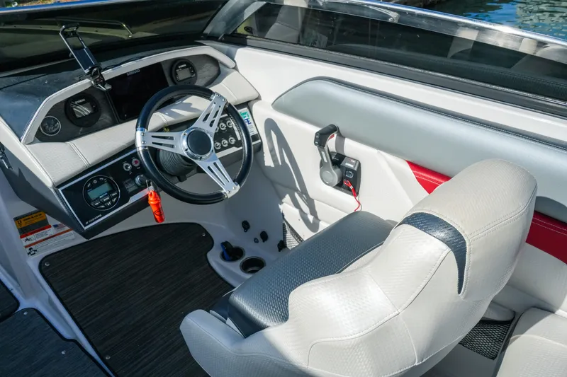 Slide: The Image of 2018 Four Winns HD240 OB boat cockpit with modern steering and controls. - 19