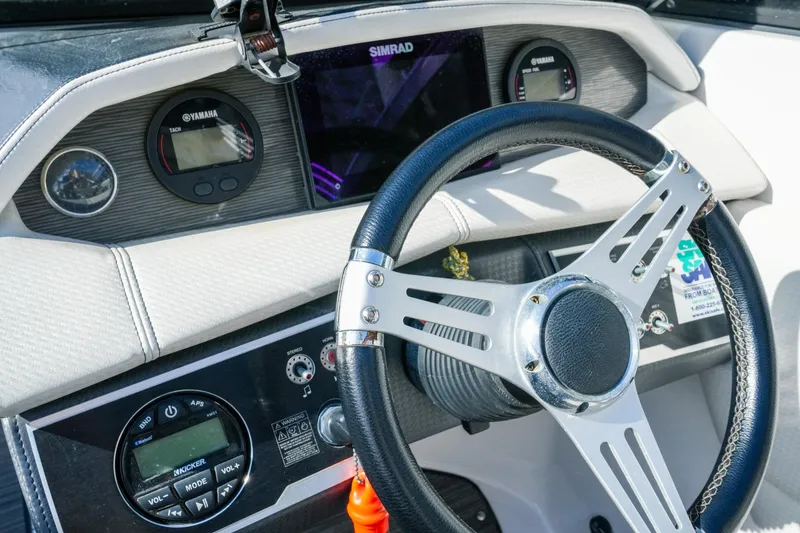 Slide: The Image of Steering wheel and dashboard of 2018 Four Winns HD240 OB boat with Yamaha gauges. - 20