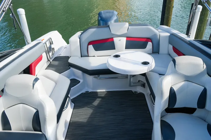Slide: The Image of Interior of 2018 Four Winns HD240 OB boat with seating and table. - 35