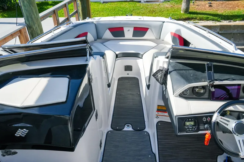 Slide: The Image of 2018 Four Winns HD240 OB boat interior with sleek dashboard and comfortable seating. - 21