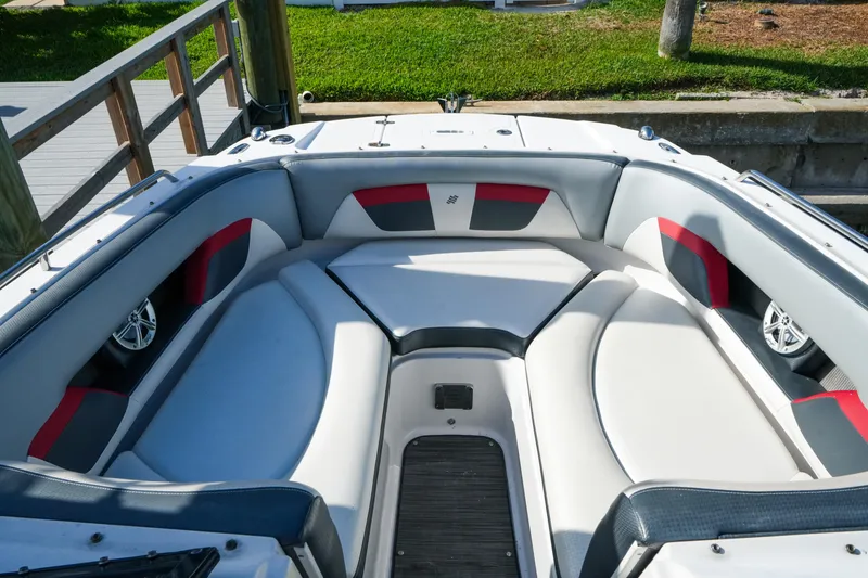Slide: The Image of 2018 Four Winns HD240 OB boat interior with cushioned seating and modern design. - 22