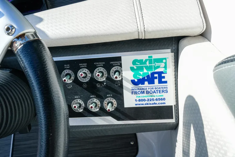 Slide: The Image of Control panel of a 2018 Four Winns HD240 OB boat with Ski Safe insurance sticker. - 41