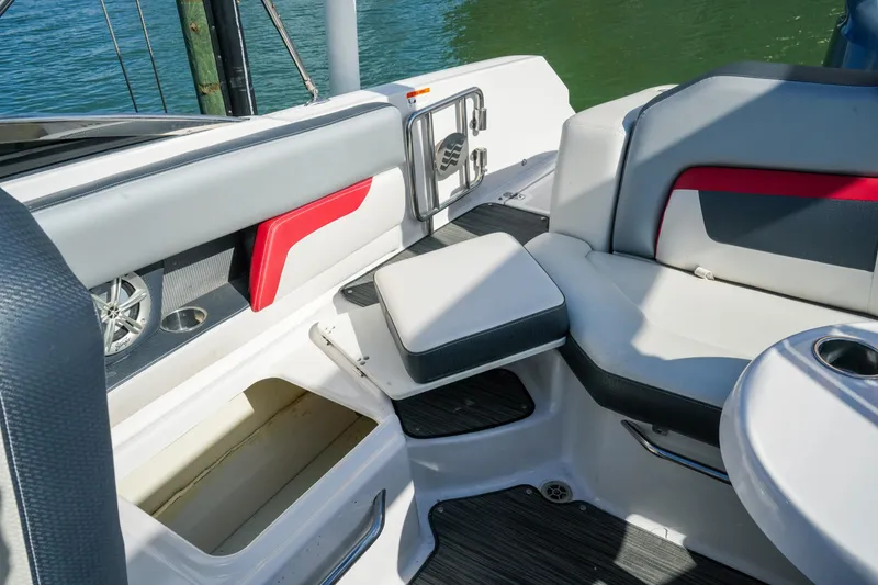 Slide: The Image of Interior of 2018 Four Winns HD240 OB boat with seating and storage compartments. - 46