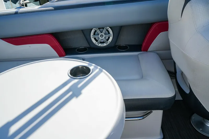 Slide: The Image of Interior of 2018 Four Winns HD240 OB boat with seating and cup holders. - 17