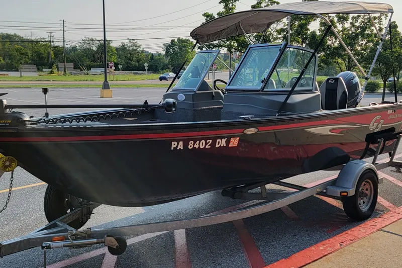 Slide: The Image of 2014 G3 Angler V164 F fishing boat on trailer in parking lot. - 6