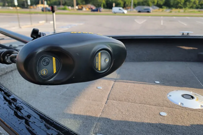 Slide: The Image of Close-up of a 2014 G3 Angler V164 F boat's trolling motor in a parking lot. - 7