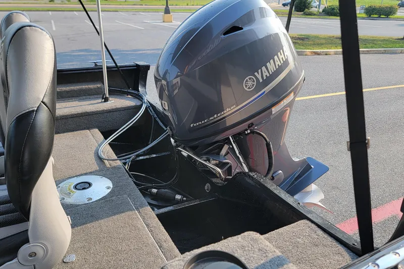 Slide: The Image of 2014 G3 Angler V164 F boat with Yamaha outboard motor in parking lot. - 12