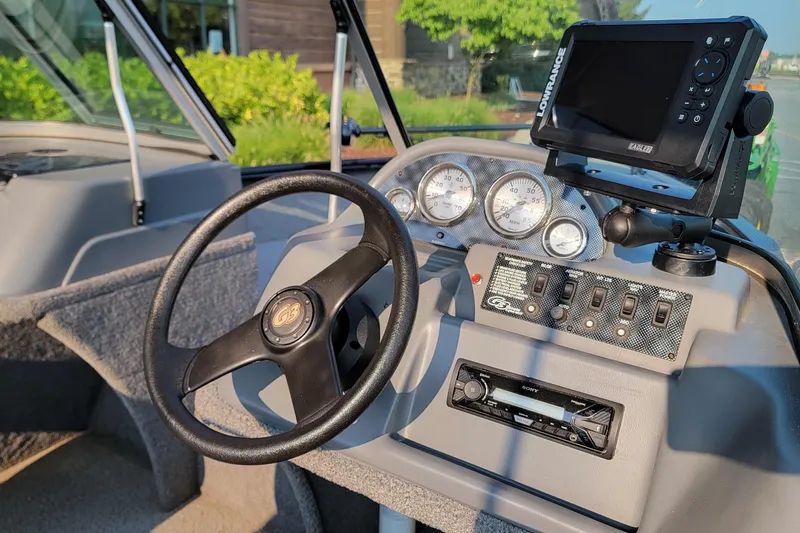 Slide: The Image of 2014 G3 Angler V164 F boat dashboard with steering wheel and navigation system. - 3