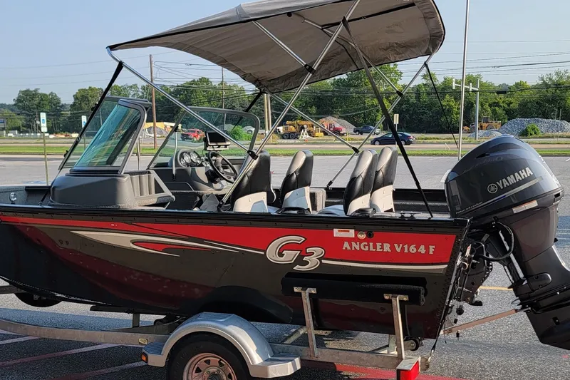 Slide: The Image of 2014 G3 Angler V164 F boat with Yamaha motor on a trailer. - 13