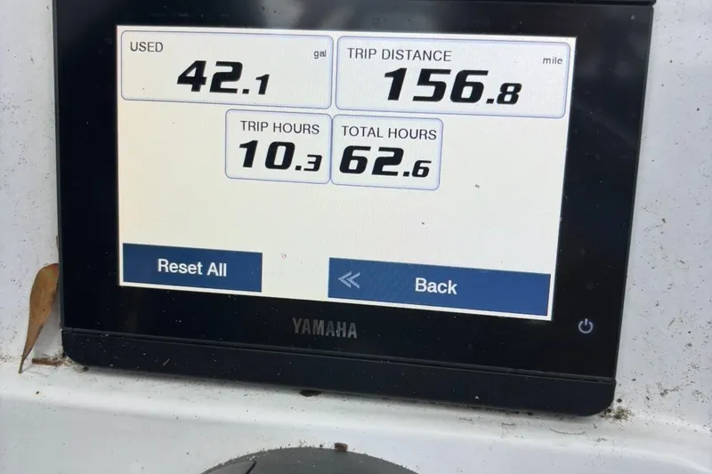 Slide: The Image of Display screen showing fuel usage and trip data for Sea Hunt Ultra 234 boat. - 16