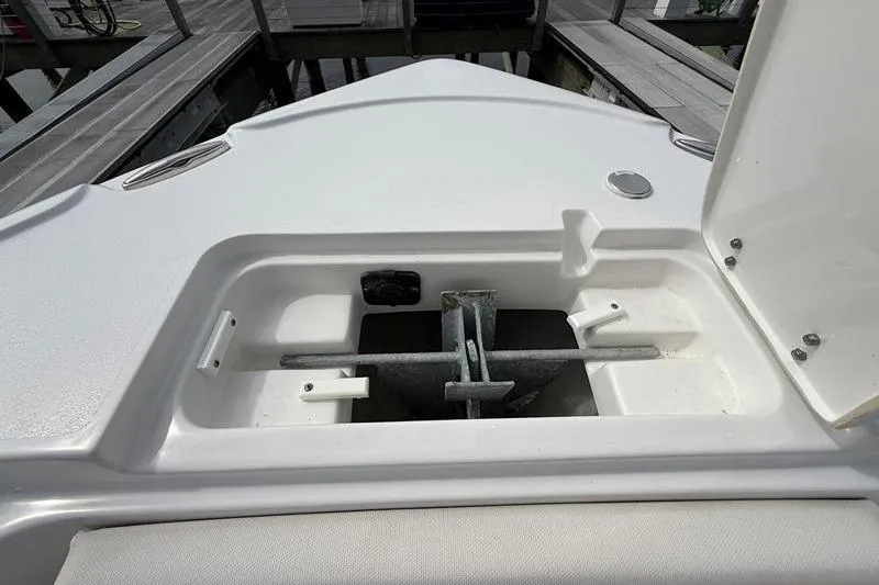 Slide: The Image of Anchor storage compartment on a 2022 Sea Hunt Ultra 234 boat. - 26