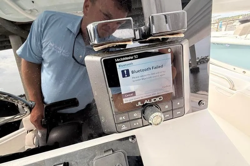 Slide: The Image of JL Audio MediaMaster 50 on 2022 Sea Hunt Ultra 234 displaying Bluetooth error message. - 15