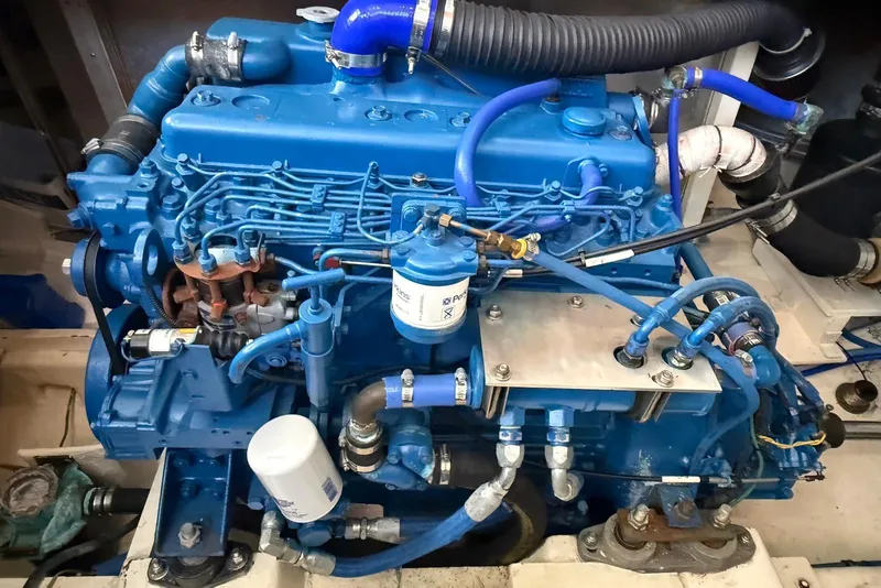 Slide: The Image of Engine of a 1985 DeFever 40 Offshore Cruiser, showcasing detailed mechanical components. - 47