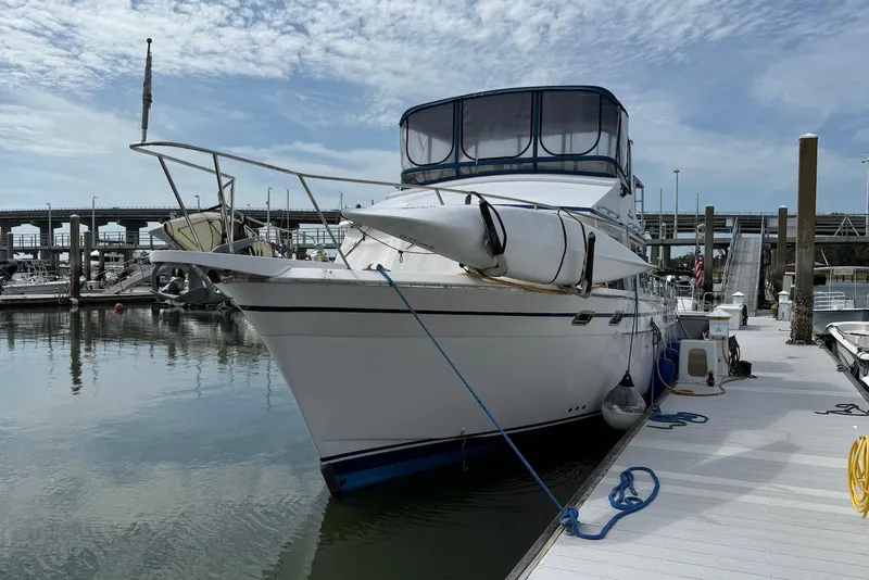 Slide: The Image of 1985 DeFever 40 Offshore Cruiser docked at marina under clear sky. - 8
