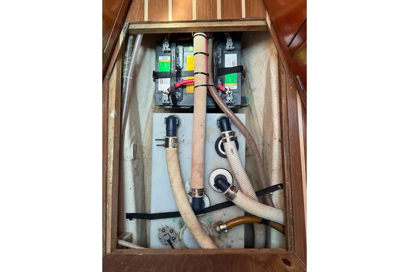 Slide: The Image of Battery and plumbing system inside a 1985 DeFever 40 Offshore Cruiser boat. - 45