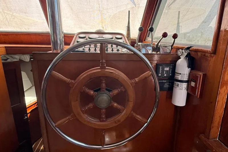 Slide: The Image of Helm of 1985 DeFever 40 Offshore Cruiser with wooden wheel and controls. - 35