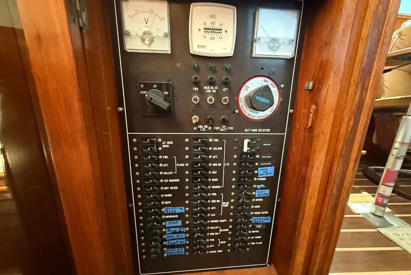 Slide: The Image of Electrical panel of 1985 DeFever 40 Offshore Cruiser with switches and gauges. - 37