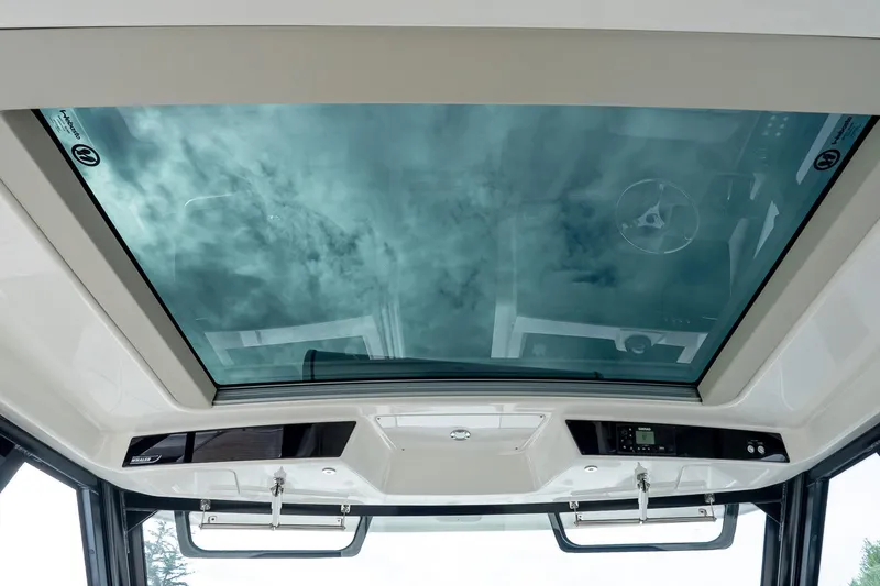 Slide: The Image of 2024 Boston Whaler 405 Conquest glass roof showcasing sky view. - 31