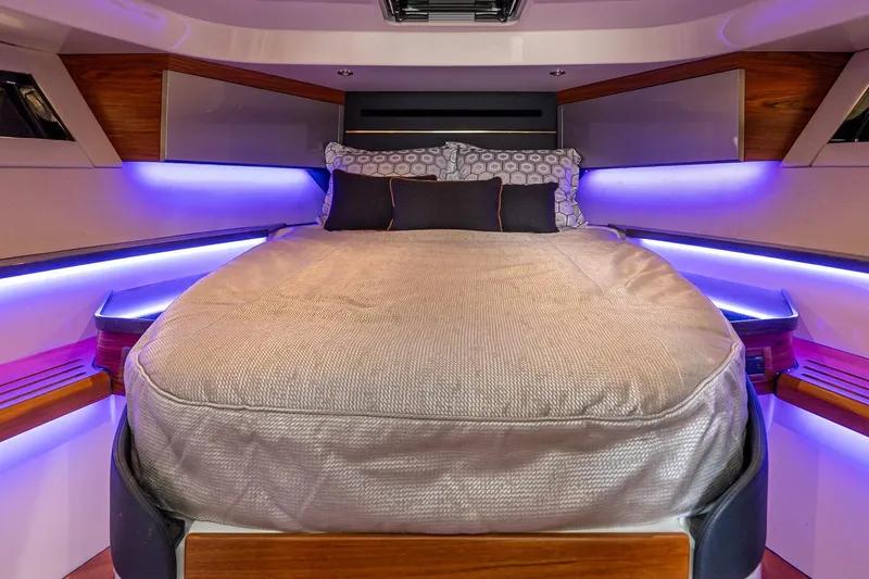 Slide: The Image of Luxurious cabin interior of 2024 Boston Whaler 405 Conquest with ambient lighting. - 56