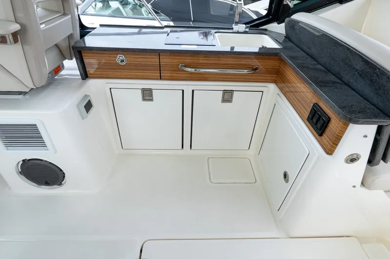 Slide: The Image of 2024 Boston Whaler 405 Conquest interior with sleek cabinetry and modern design. - 33