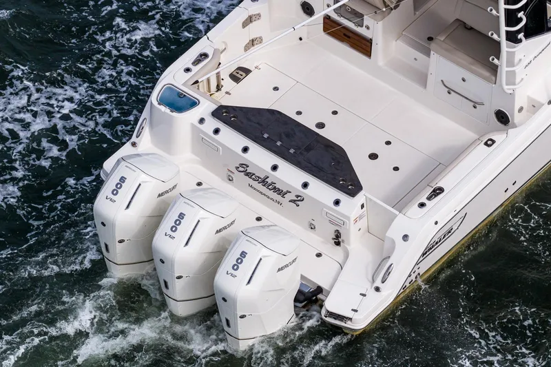 Slide: The Image of 2024 Boston Whaler 405 Conquest with triple Mercury 600 V12 engines on the water. - 10