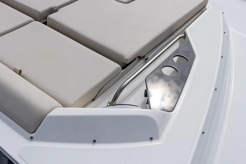 Slide: The Image of 2024 Boston Whaler 405 Conquest boat deck with cushioned seating and stainless steel cup holders. - 64