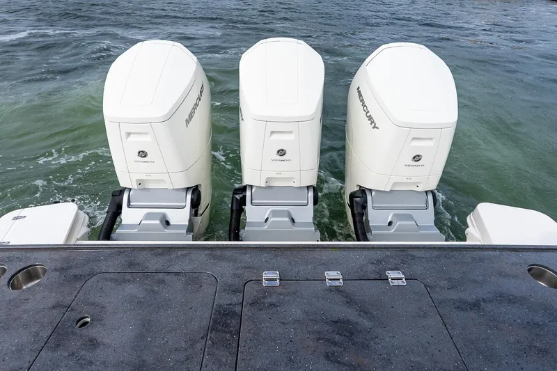 Slide: The Image of 2024 Boston Whaler 405 Conquest with triple Mercury Verado outboard engines. - 15