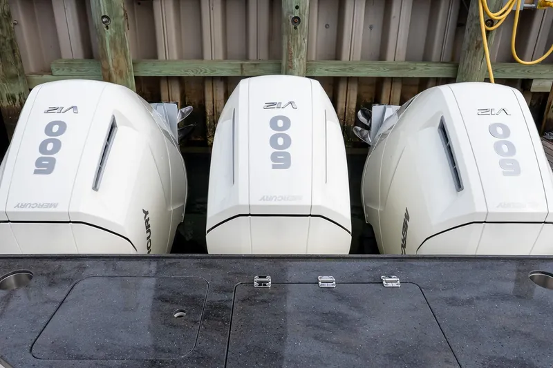 Slide: The Image of Triple Mercury 600 V12 engines on a 2024 Boston Whaler 405 Conquest boat. - 21