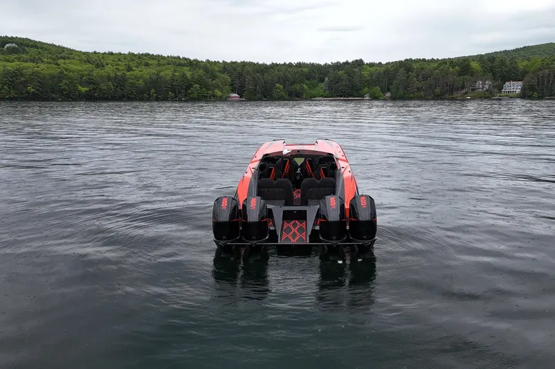Slide: The Image of Nor-Tech 4000 Roadster 2027 on a serene lake, surrounded by lush green forest. - 5