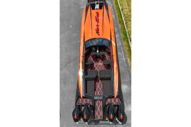 Slide: The Image of 2027 Nor-Tech 4000 Roadster, vibrant orange, aerial view showcasing sleek design and powerful engines. - 7