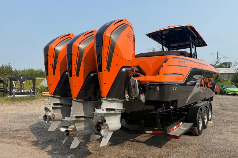 Slide: The Image of 2024 Donzi 39 VRZ boat with triple outboard engines, vibrant orange and black design. - 17