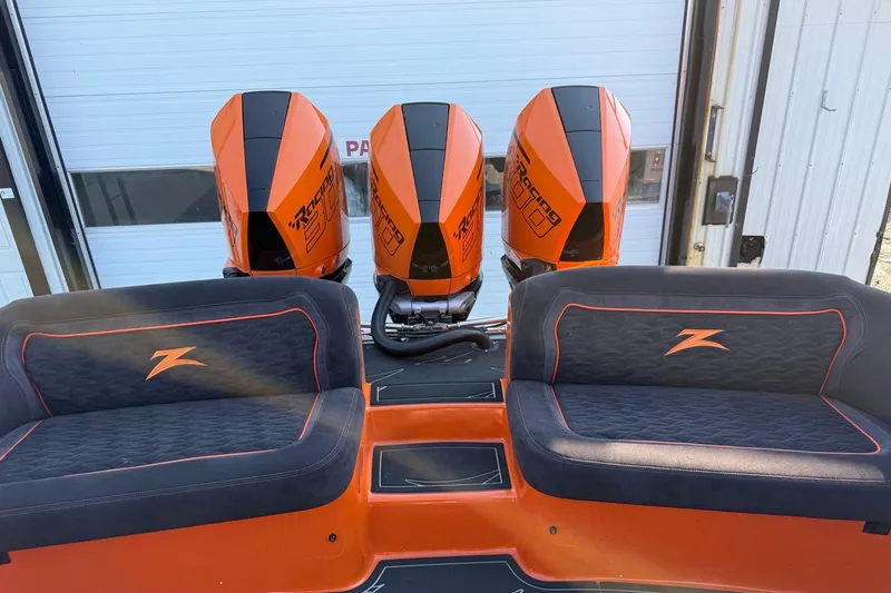 Slide: The Image of 2024 Donzi 39 VRZ boat with triple orange racing engines and custom seating. - 8