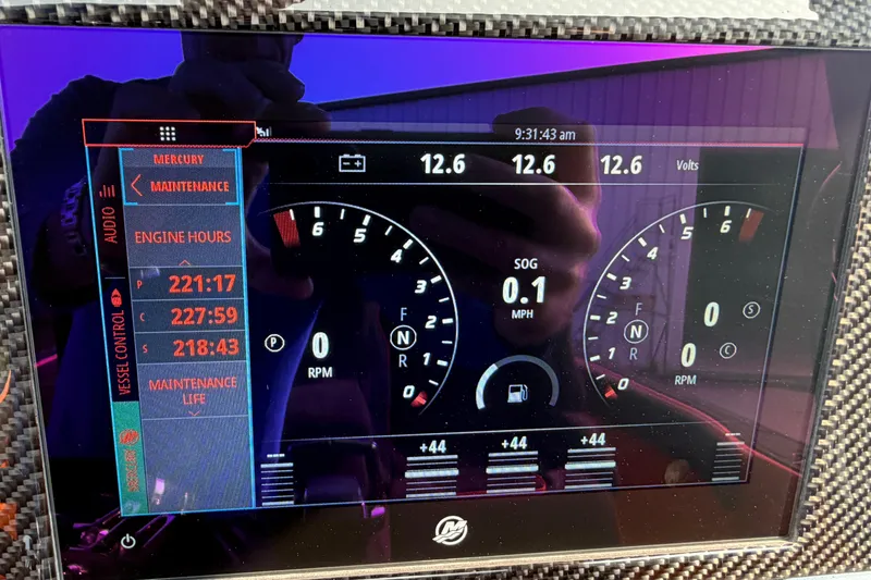 Slide: The Image of Dashboard display of a 2024 Donzi 39 VRZ showing engine hours and voltage. - 50
