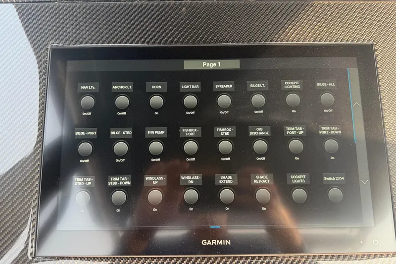 Slide: The Image of Control panel of a 2024 Donzi 39 VRZ boat with various function buttons. - 25