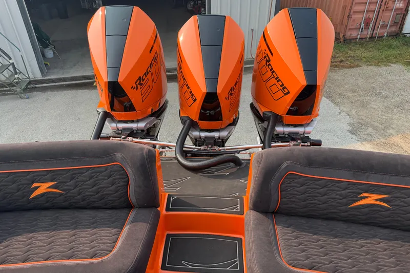 Slide: The Image of 2024 Donzi 39 VRZ boat with triple orange racing engines and custom seating. - 19