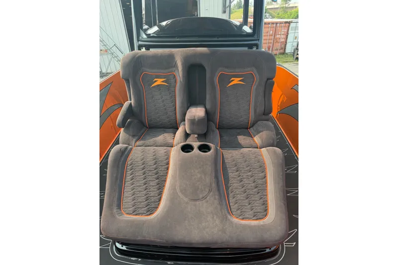 Slide: The Image of 2024 Donzi 39 VRZ boat seats with orange accents and cup holders. - 30