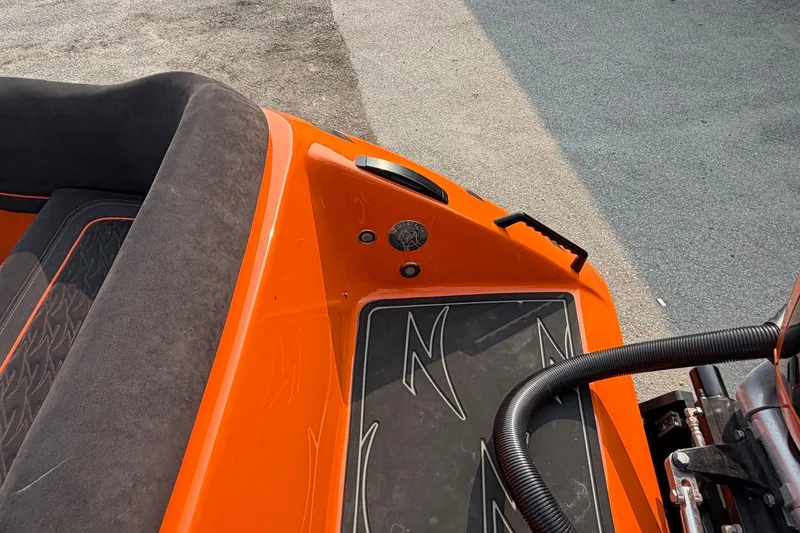 Slide: The Image of 2024 Donzi 39 VRZ boat interior with orange and black seating and deck details. - 48